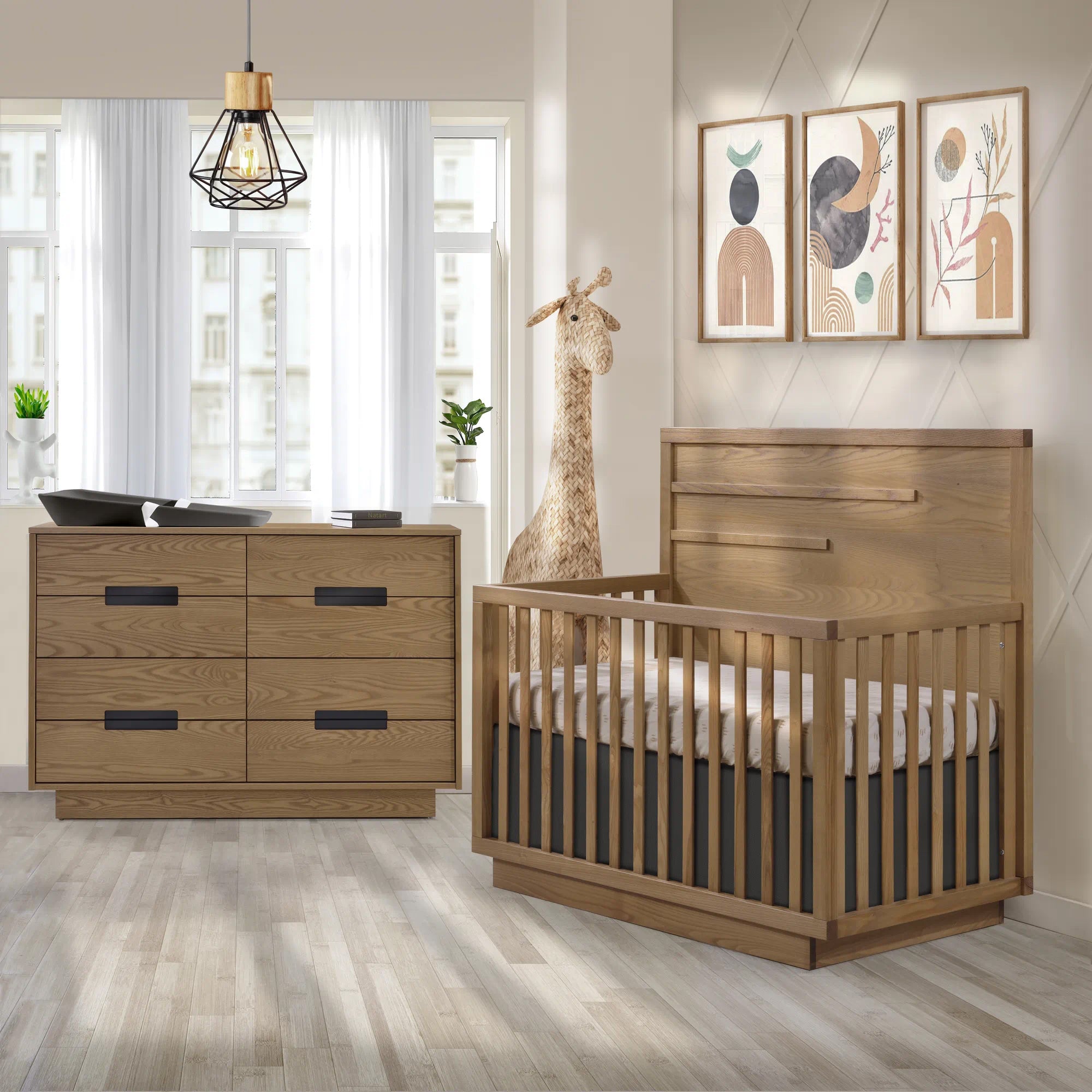 A baby room with the Natart Como crib and a dresser