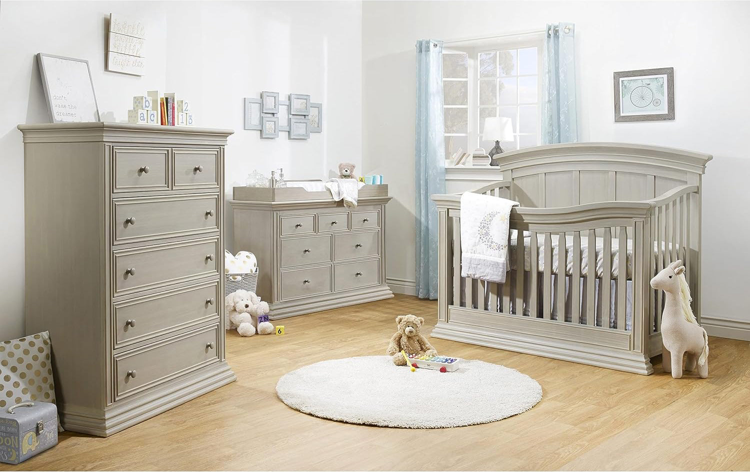 A well-furnished baby room showcasing the Sorelle Providence crib, dresser, and additional furniture, creating a nurturing environment.