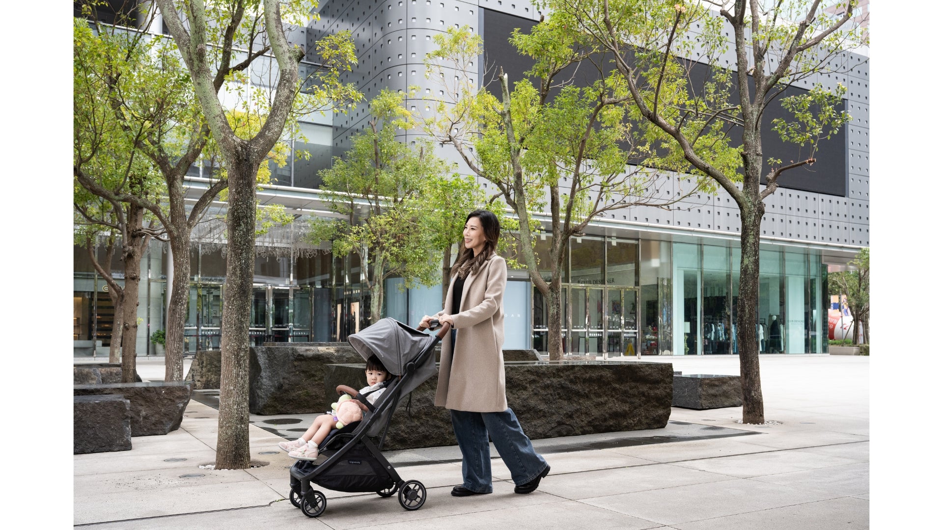 UPPAbaby Minu V3 with toddler pushed in city