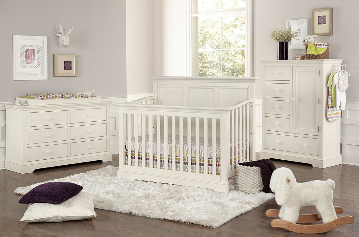 A cozy baby room featuring the Westwood Hanley crib, dresser, and chest, designed for comfort and functionality.